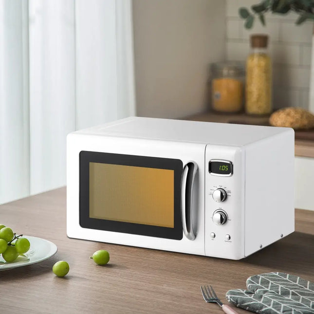 Costway 0.9 cu.ft white retro countertop microwave oven, compact design with digital controls and turntable for easy heating.