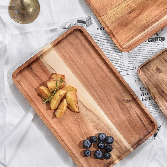 Wooden trays with food on a newspaper background
