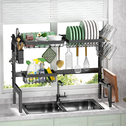 Kitchen dish rack with various utensils and items on a kitchen counter.
