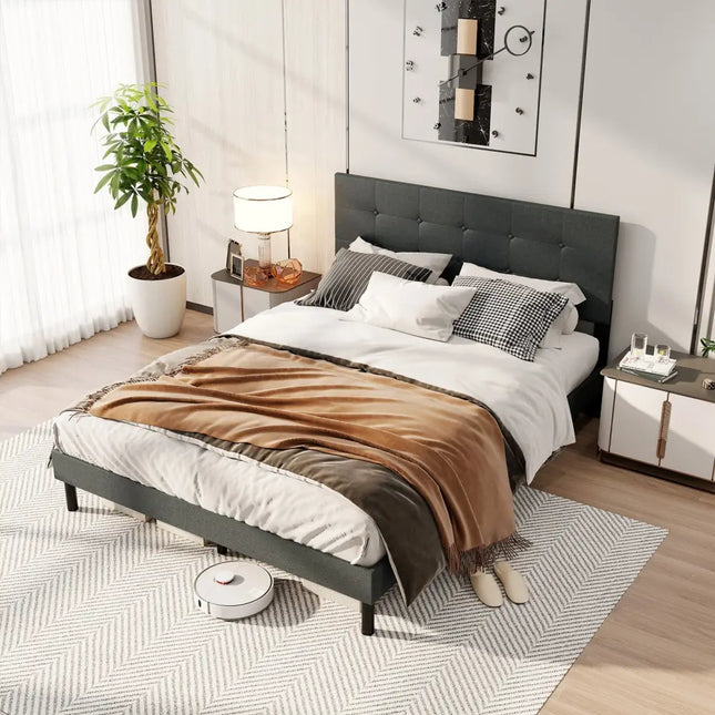 Modern bedroom with a bed, nightstands, and a robot vacuum cleaner.
