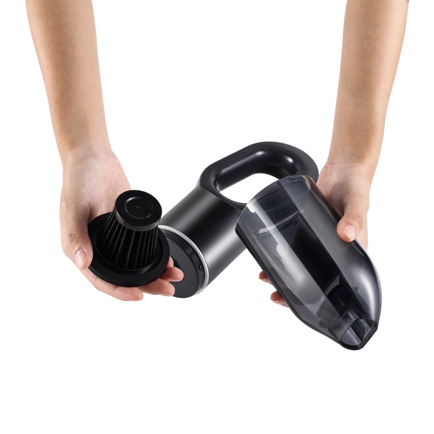 Black handheld vacuum cleaner held by two hands on a white background