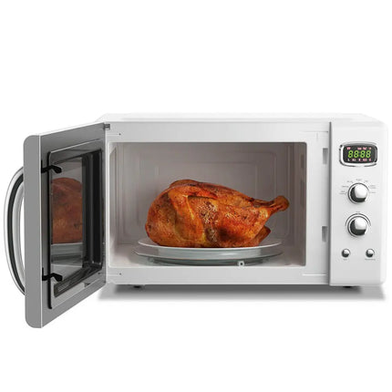 White 0.9 cu ft retro countertop microwave oven by Costway, compact design ideal for small kitchens and quick heating.
