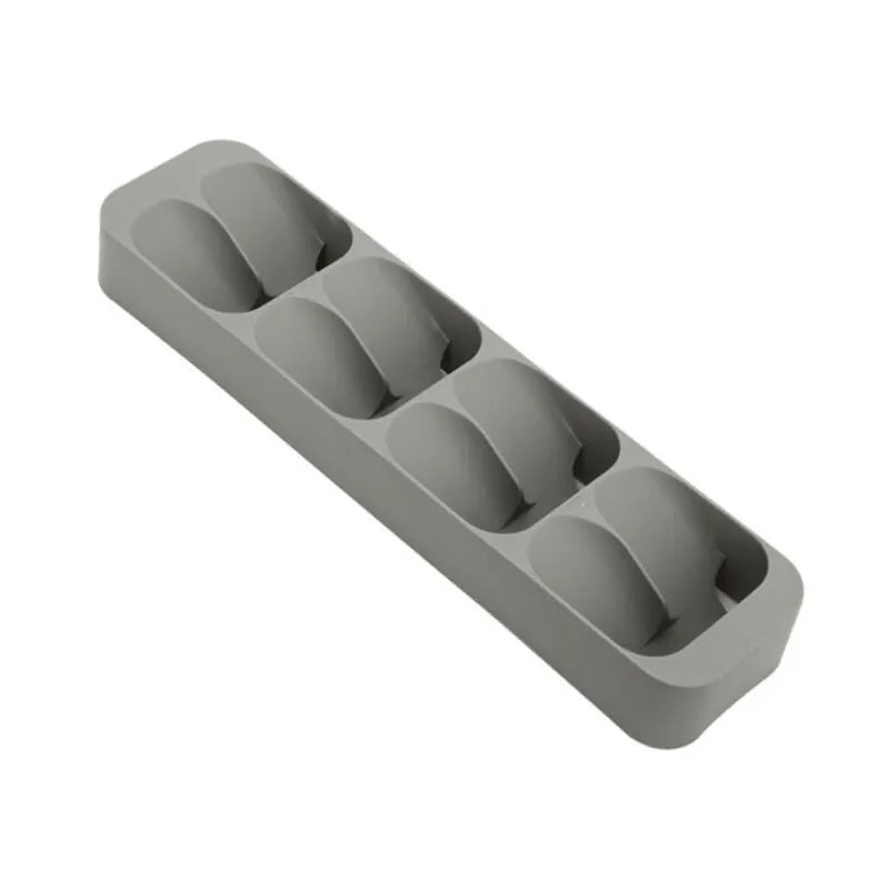 Gray silicone ice cube tray on a white background