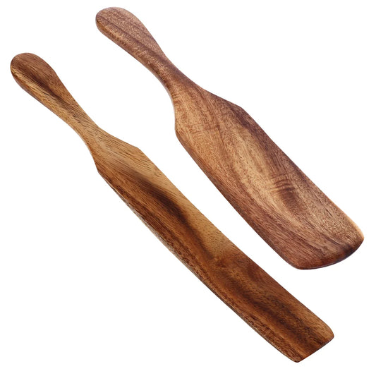 Two wooden spoons on a white background