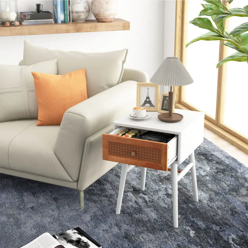 White modern bedside table with one drawer and solid wood legs, ideal for stylish bedroom nightstands.