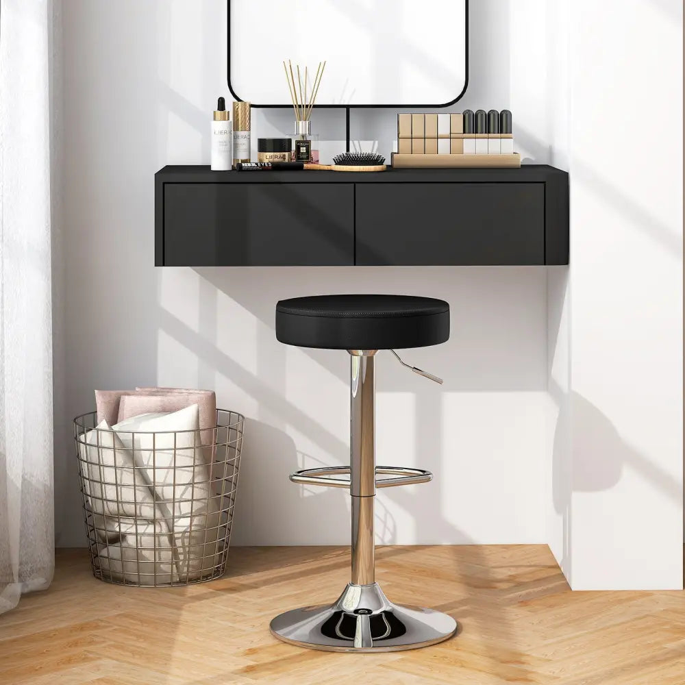 Black adjustable swivel bar stool with round seat and modern design from Costway, ideal for home or bar seating.