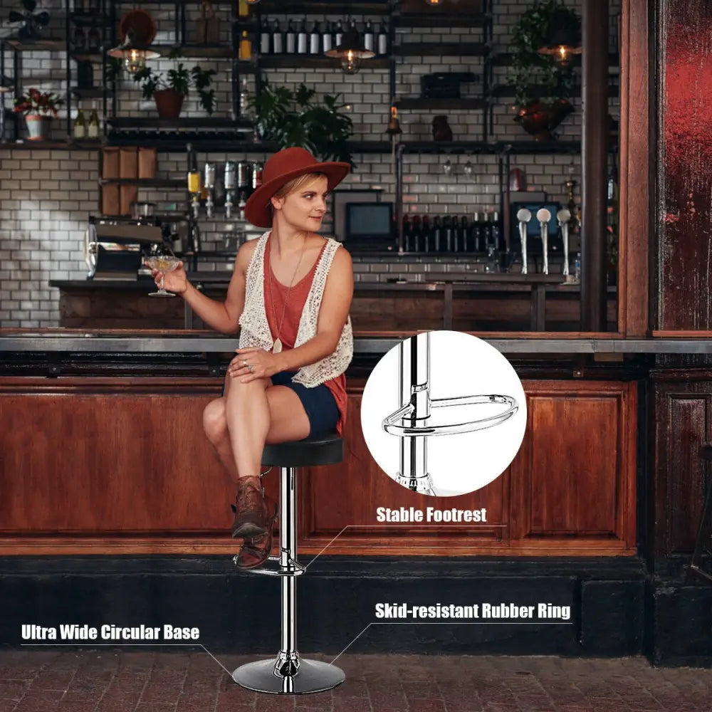 Black adjustable round bar stool with swivel seat and modern design, ideal for pub and counter seating by Costway.