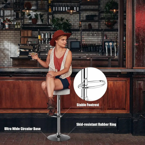 White adjustable round bar stool with swivel pub chair features from Costway, showcasing a modern, cushioned seat and sturdy metal base.