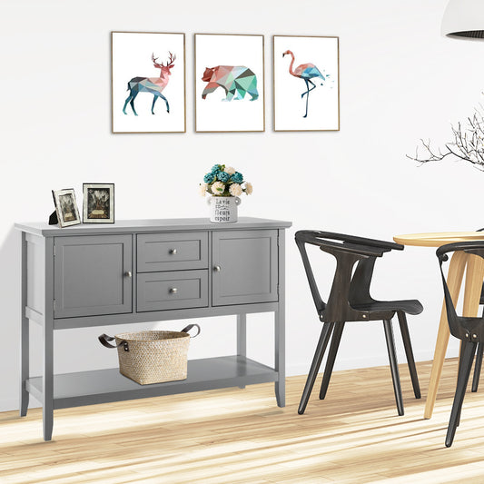 Gray console table with decorative items in a room with chairs and wall art.