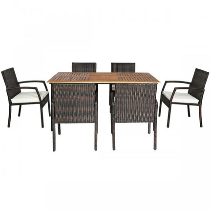Outdoor furniture set with a square wooden table and six wicker chairs on a white background
