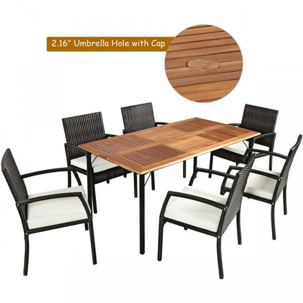 Outdoor dining set with wooden table and black chairs on a white background