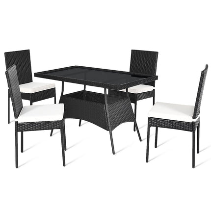 Black outdoor dining table with four matching chairs on a white background