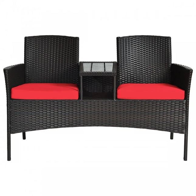 Black wicker outdoor furniture set with red cushions on a white background