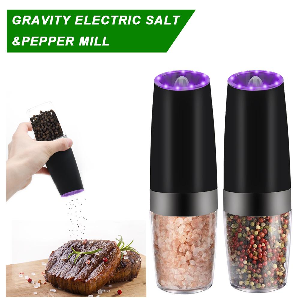 Electric salt and pepper mill set with a hand holding a grinder and a close-up of the mill contents.