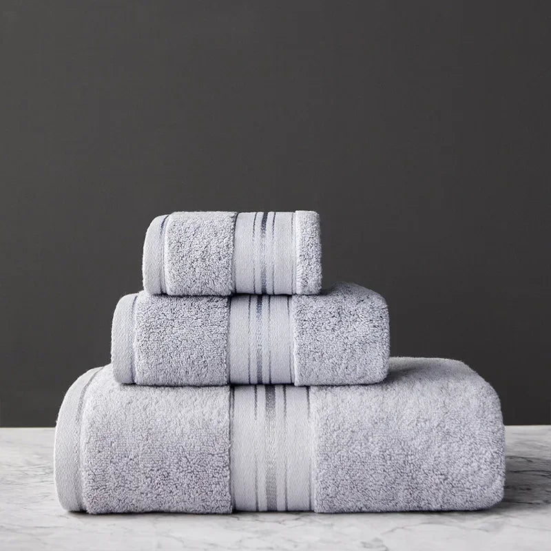 Stack of gray towels on a dark background