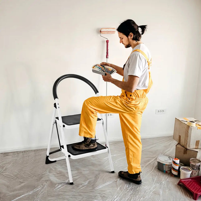 2.75 Feet Folding Step Stool with Iron Frame and Anti-Slip Pedals for 330lbs Capacity - Black - Ladders