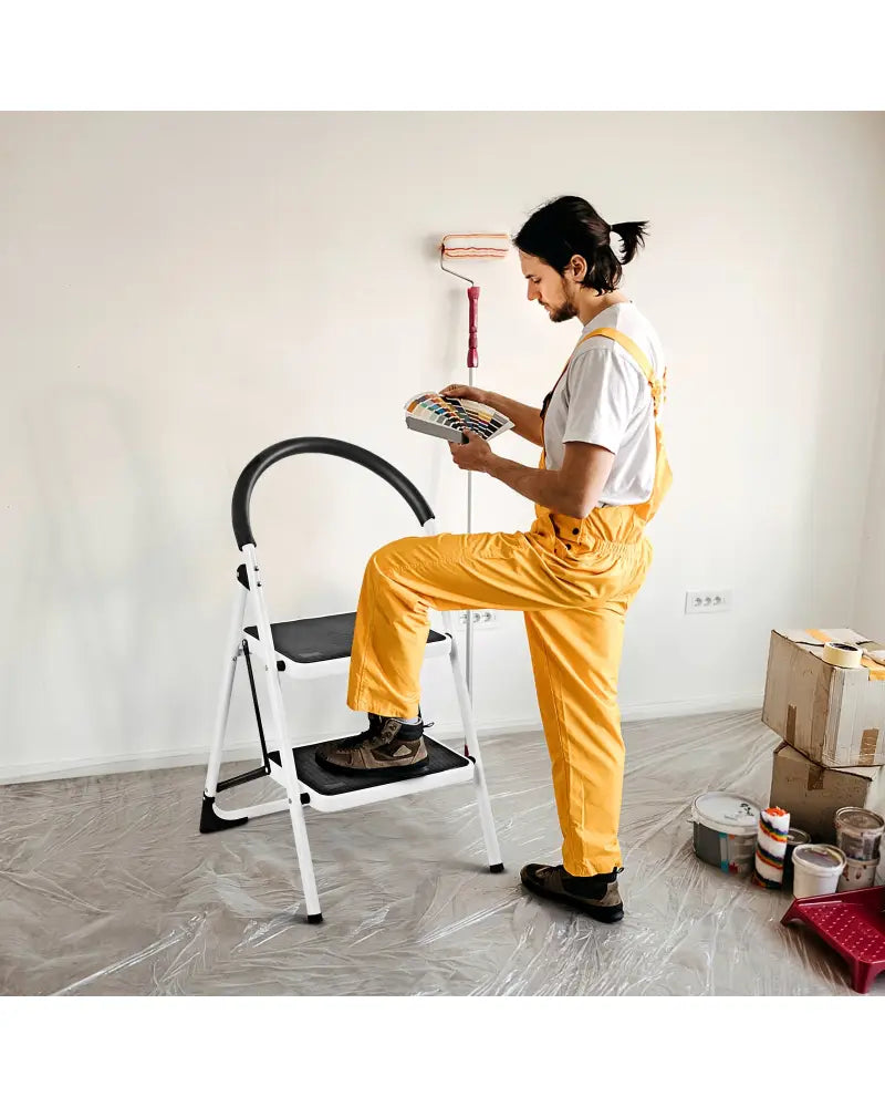 2.75 Feet Folding Step Stool with Iron Frame and Anti-Slip Pedals for 330lbs Capacity - Black - Ladders