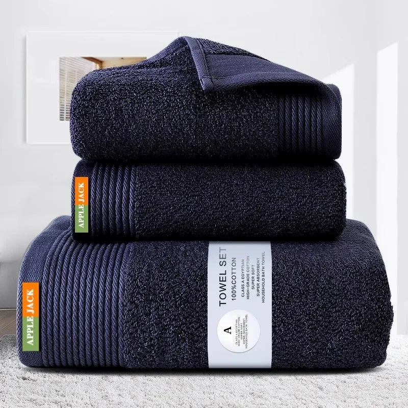 Set of three navy blue towels with 'Apple Jack' branding on a light gray background