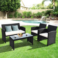 4 Pieces Rattan Patio Furniture Set with Weather Resistant Cushions and Tempered Glass Tabletop-White - White - Patio