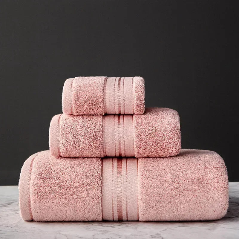 Stack of pink towels on a dark background