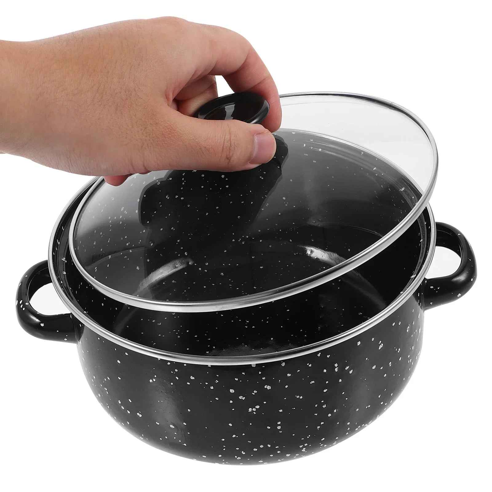 Black speckled cookware set with a glass lid being held by a hand on a white background