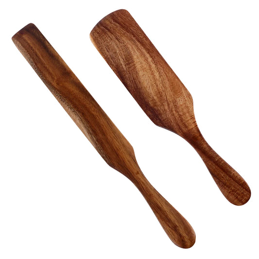 Two wooden spatulas on a white background