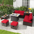 Outdoor patio set with red cushions on a patio area with plants and flowers.