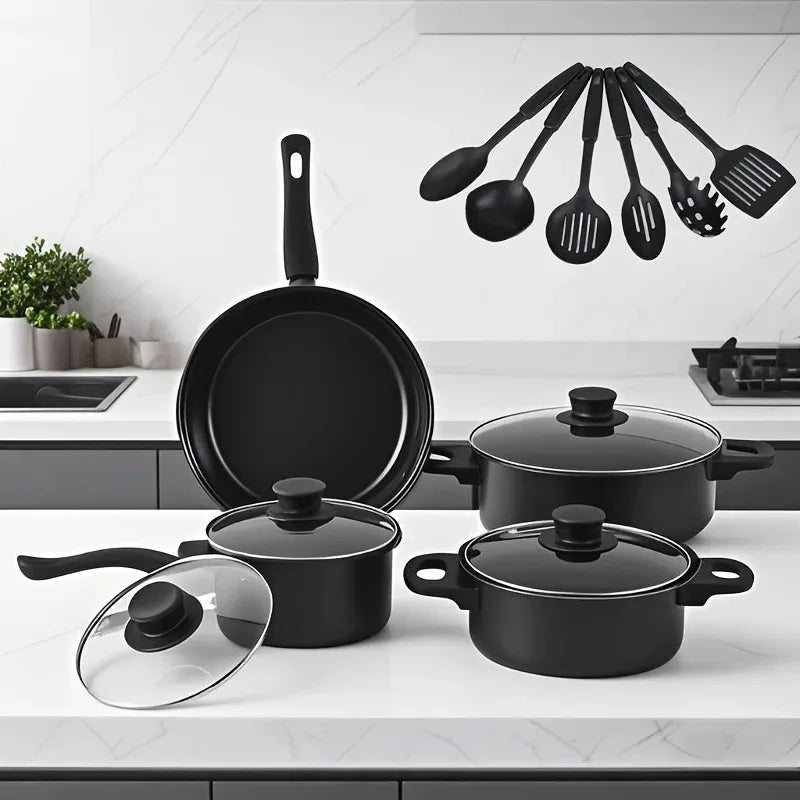 Black cookware set on a kitchen counter with utensils in the background