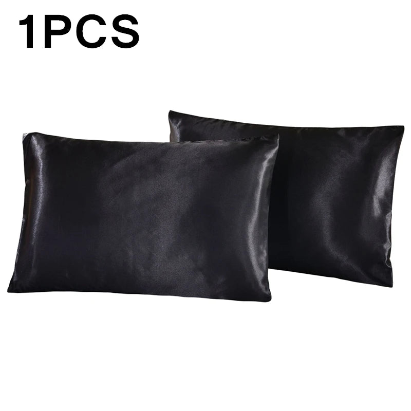 Two black satin pillowcases on a white background with '1PCS' text above.