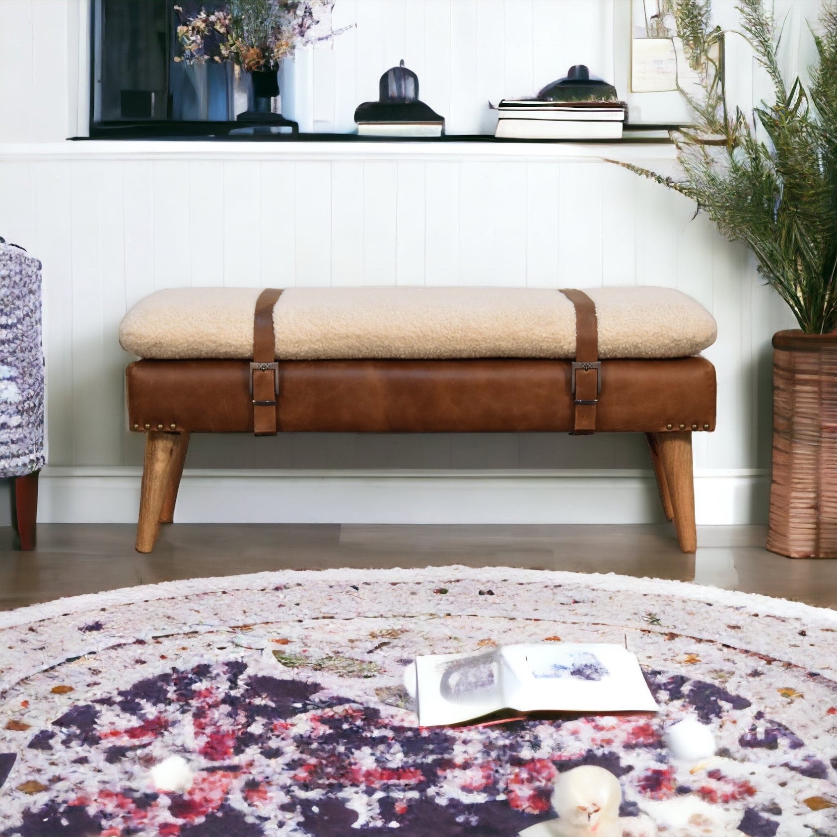 Modern boucle bench with white cushion and buffalo hide leather base – rustic accent seating for living room or entryway.