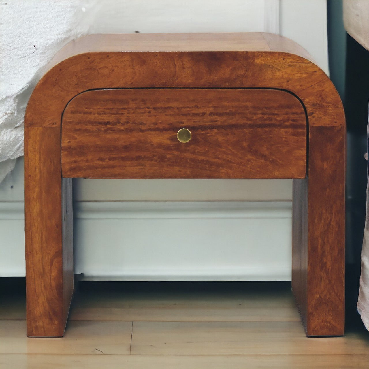 Darcy chestnut nightstand with curved edges and one drawer with brass knob
