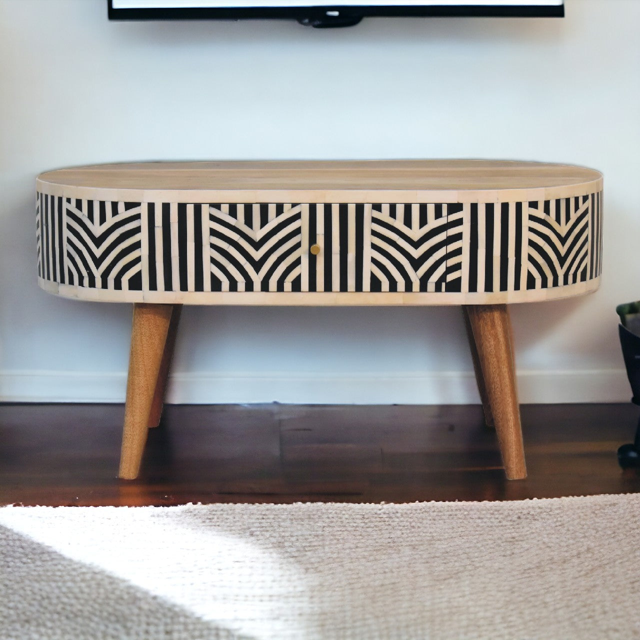 Edessa Bone Inlay Coffee Table with intricate bone inlay, drawers, and Nordic-style legs. Full view positioned in a living room