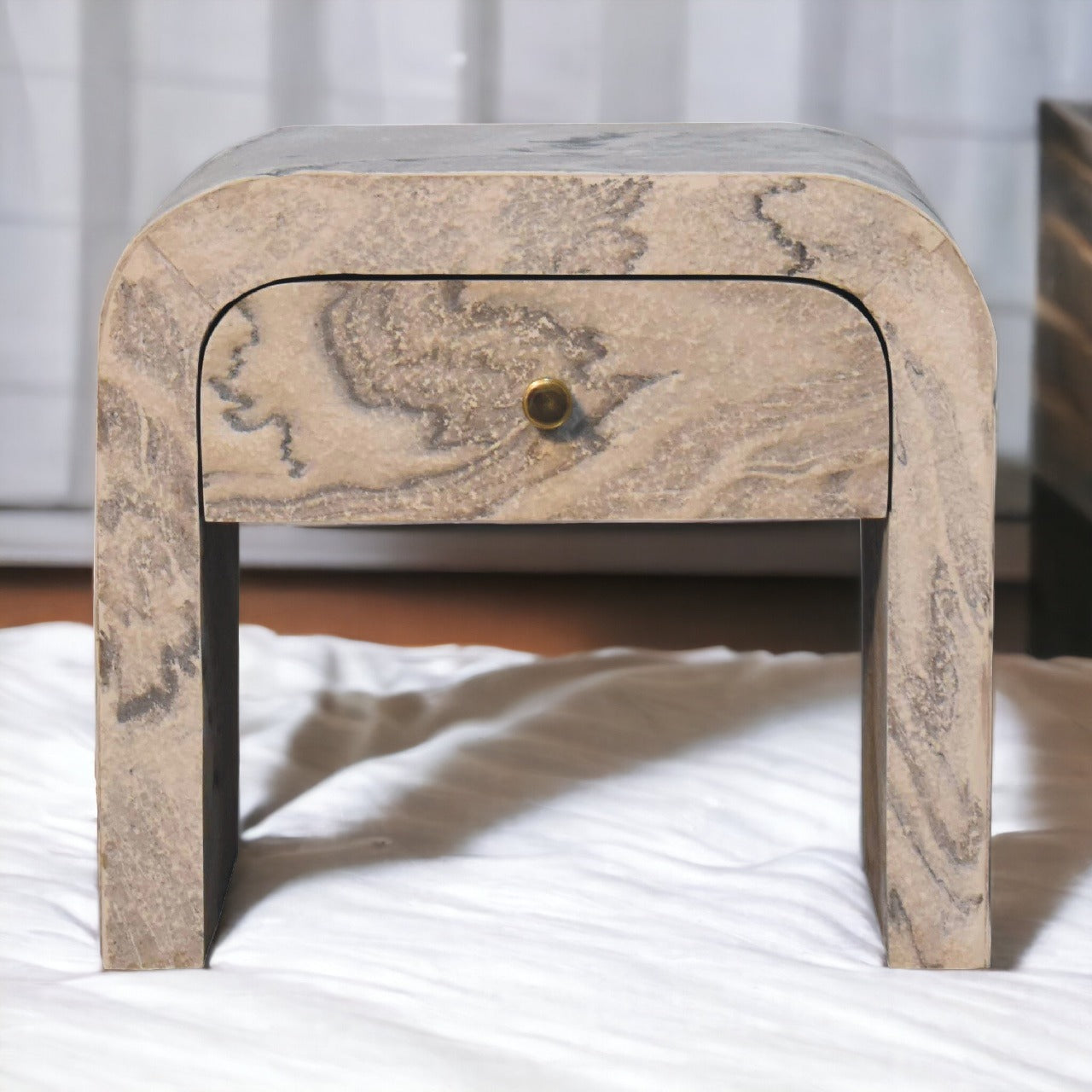 Nouveau nightstand with marble effect veneer, solid mango wood frame, and brass round knob.