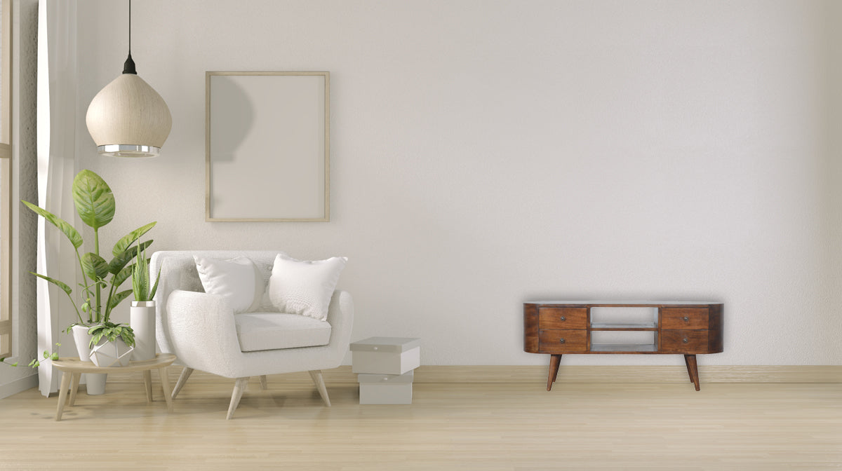 Chestnut Rounded Entertainment Unit made from solid mango wood with 4 drawers and Nordic-style legs. Unit positioned in a living room