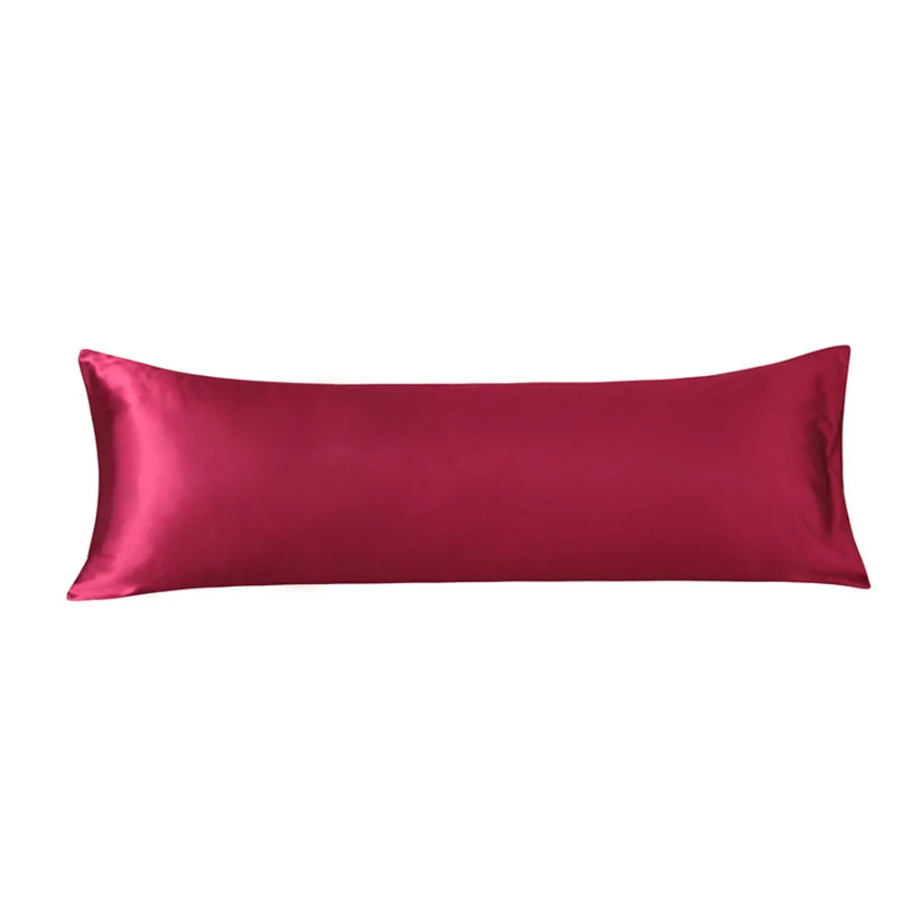 Red satin pillow on a white background