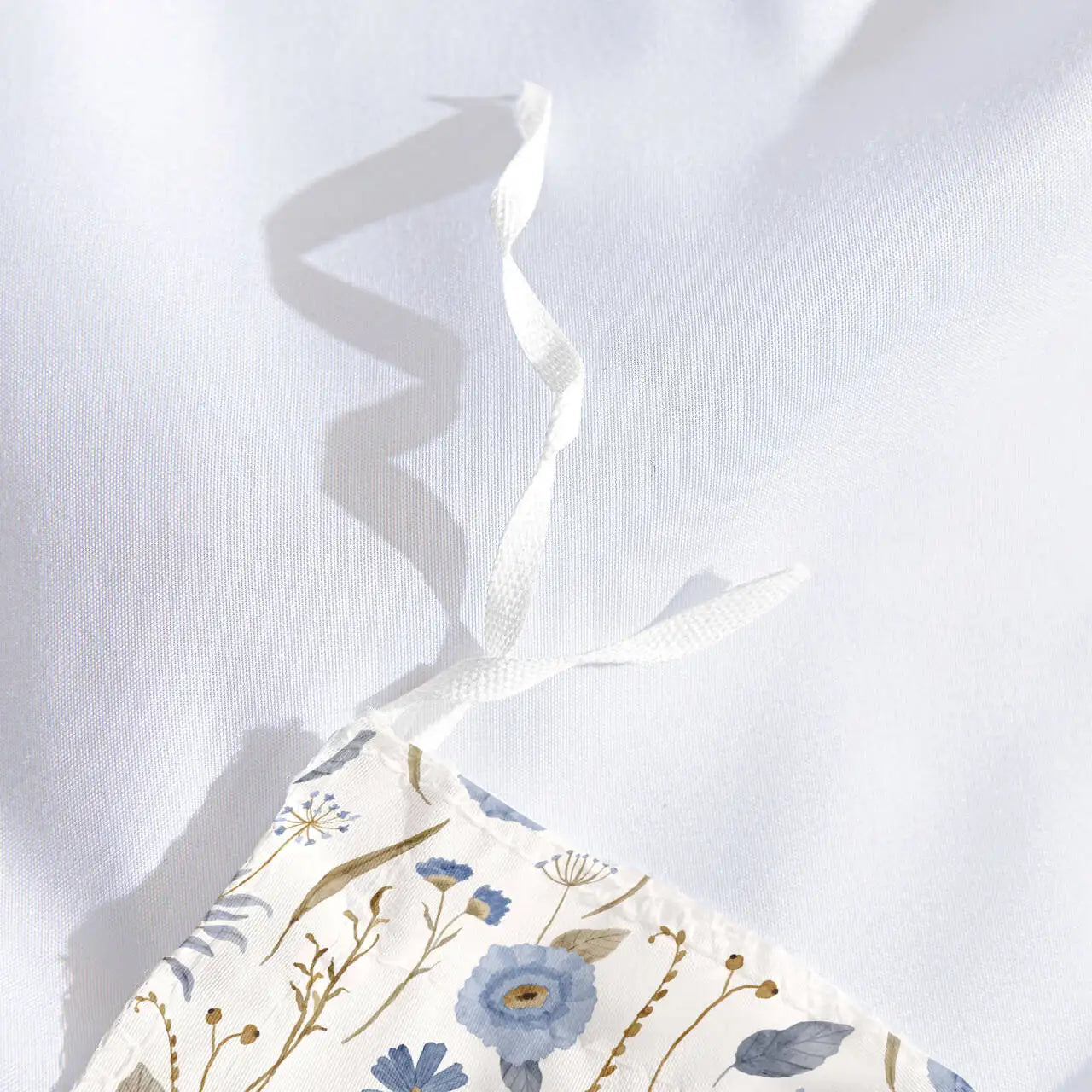 Floral-patterned fabric with a white background
