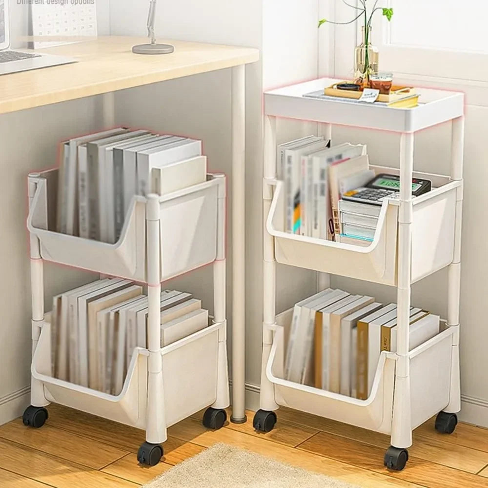 Two white rolling shelves with books and office supplies in a room.