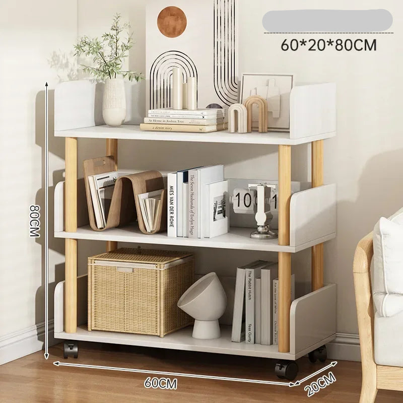 Three-tiered shelf with books, plants, and decor items against a neutral wall.