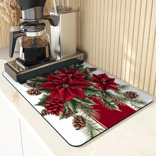 Christmas-themed mat with poinsettias and pine cones on a kitchen counter next to a coffee maker.