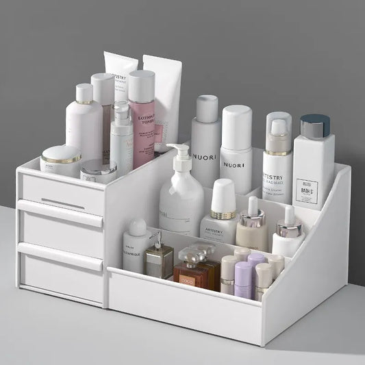 White cosmetic organizer with various skincare products on a gray background