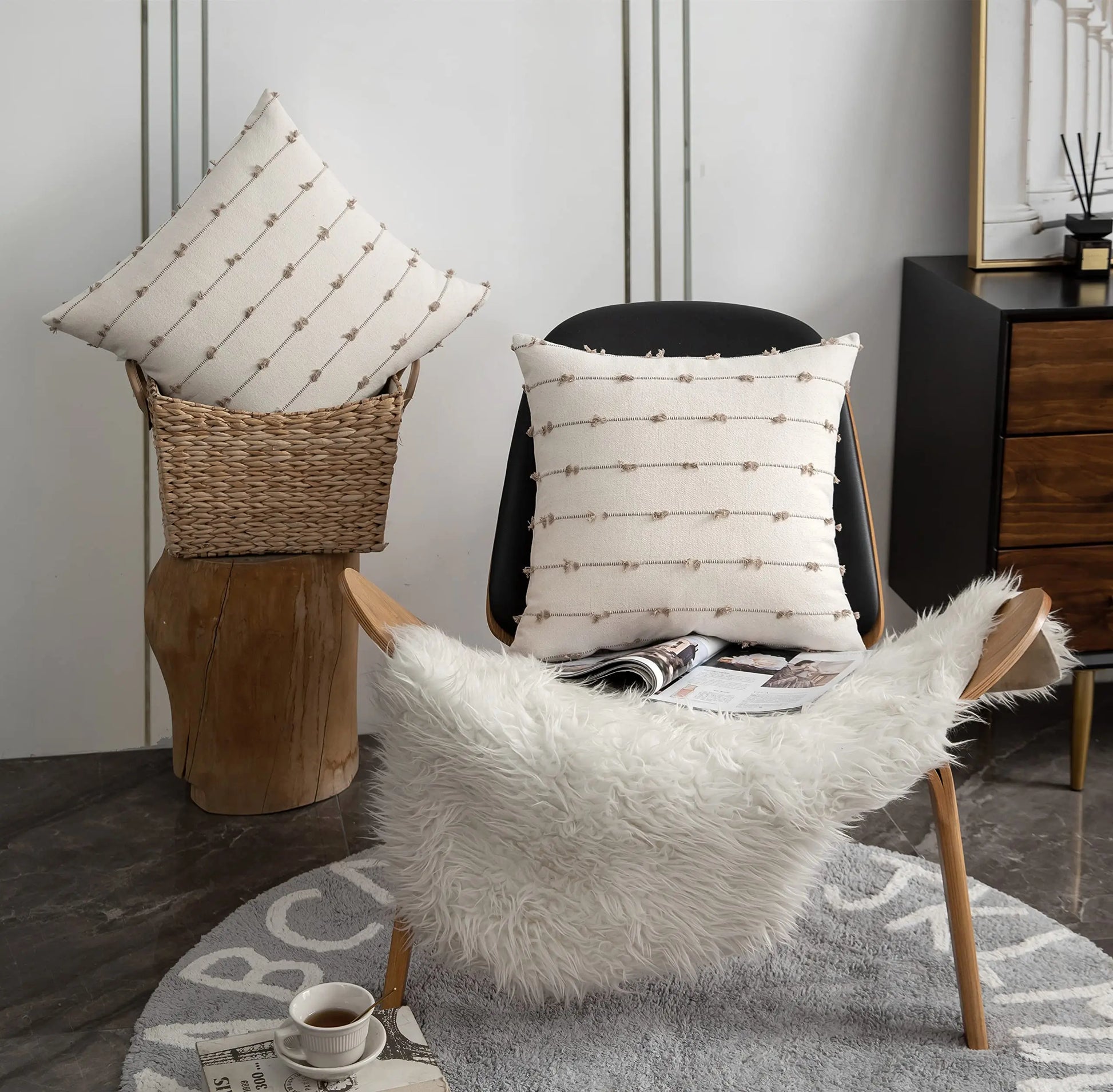 Chair with decorative pillows and a fur throw in a home setting