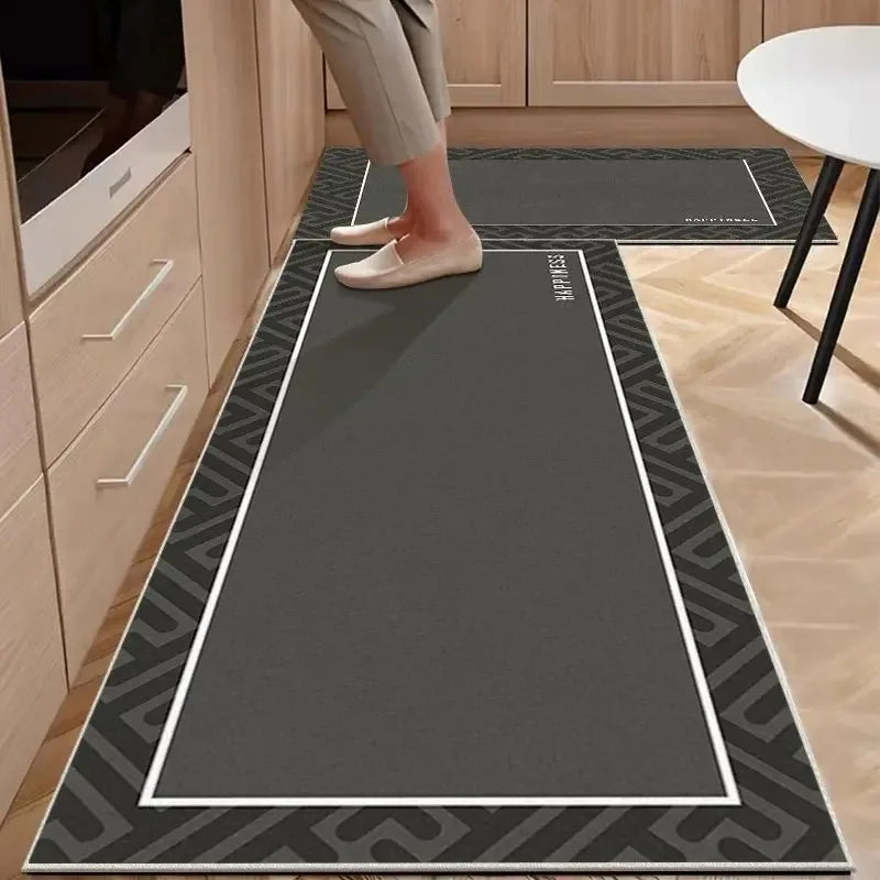 Person stepping onto a black patterned mat in a kitchen setting