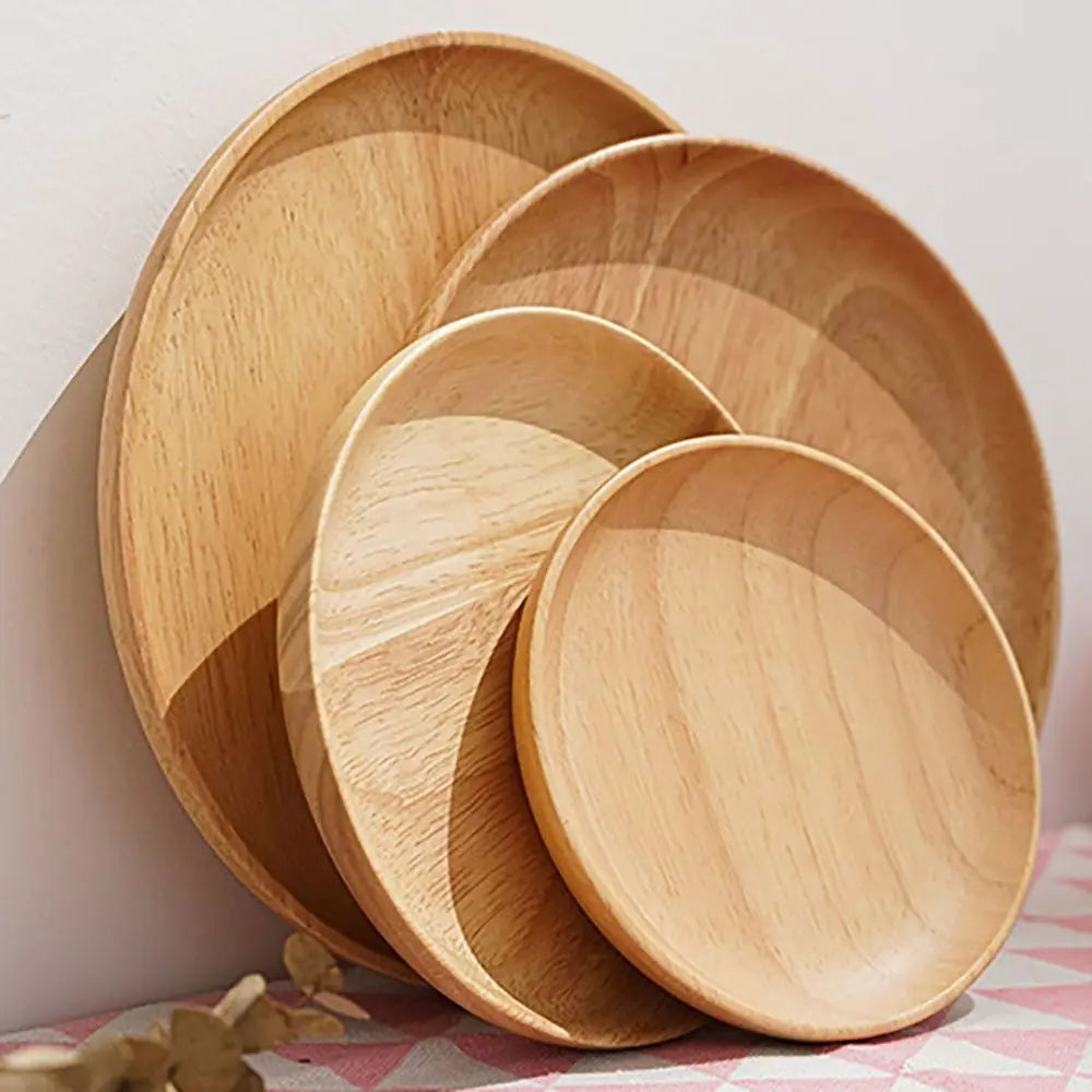 Set of wooden plates stacked on a checkered tablecloth