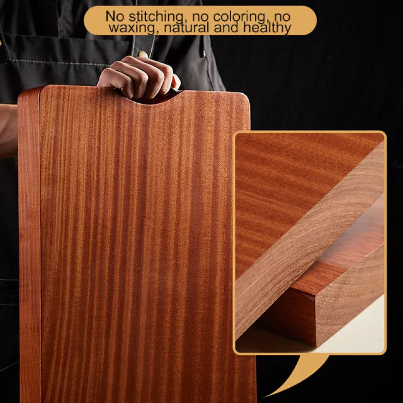 Wooden cutting board held by a person with close-up of wood texture.