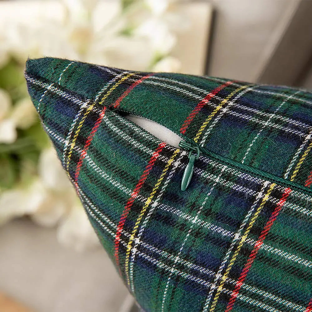 Green plaid pillow on a blurred background