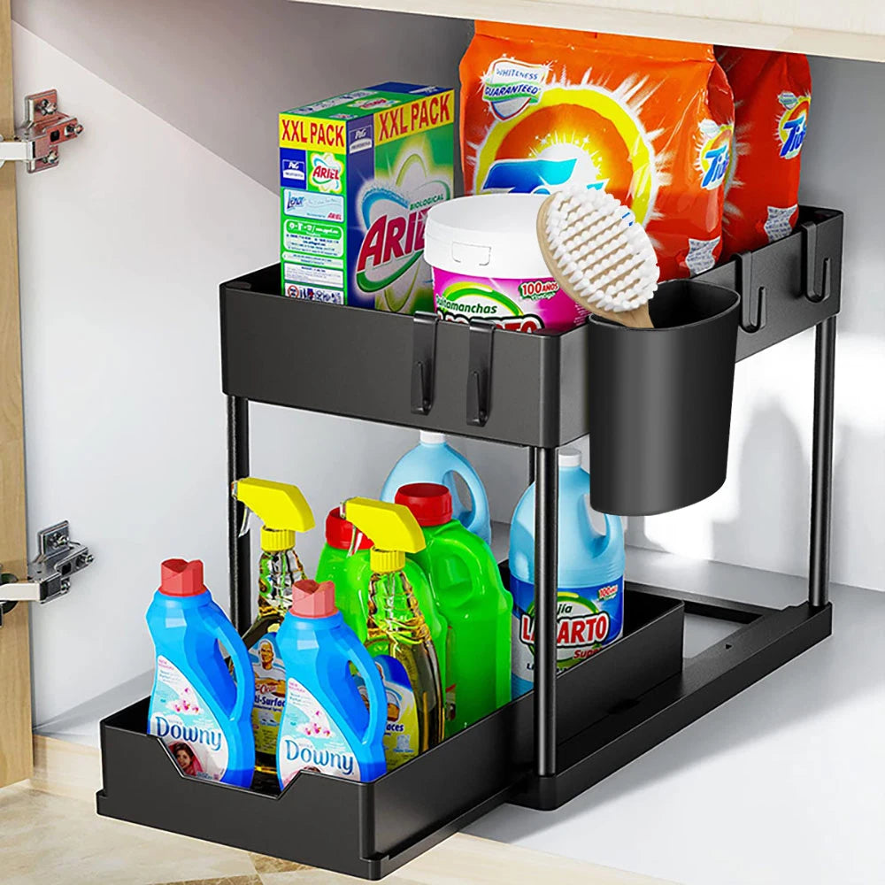 Black under-cabinet organizer with cleaning supplies inside a kitchen.