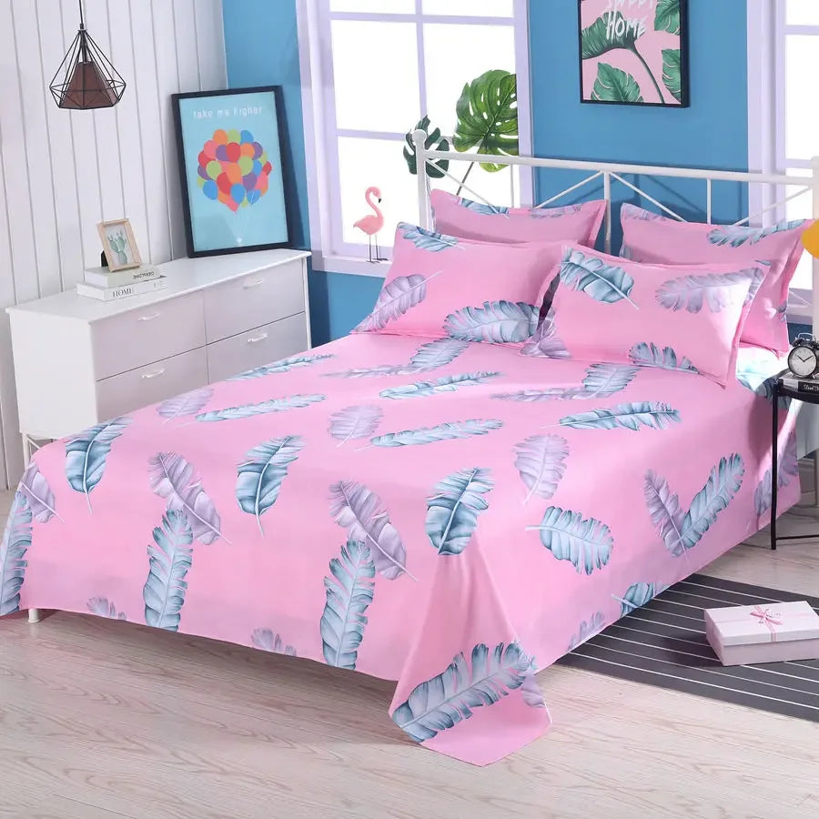 Pink bedspread with blue leaf pattern in a bedroom setting