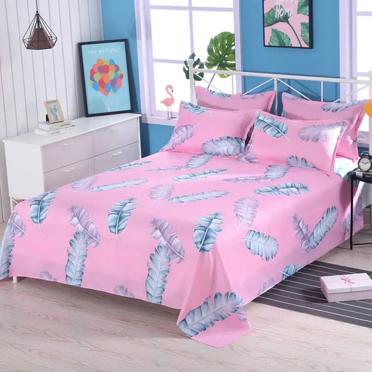 Pink bedspread with blue leaf pattern in a bedroom setting