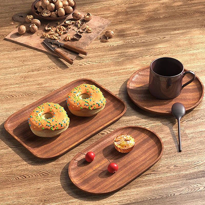 Wooden trays with pastries and a mug on a wooden surface