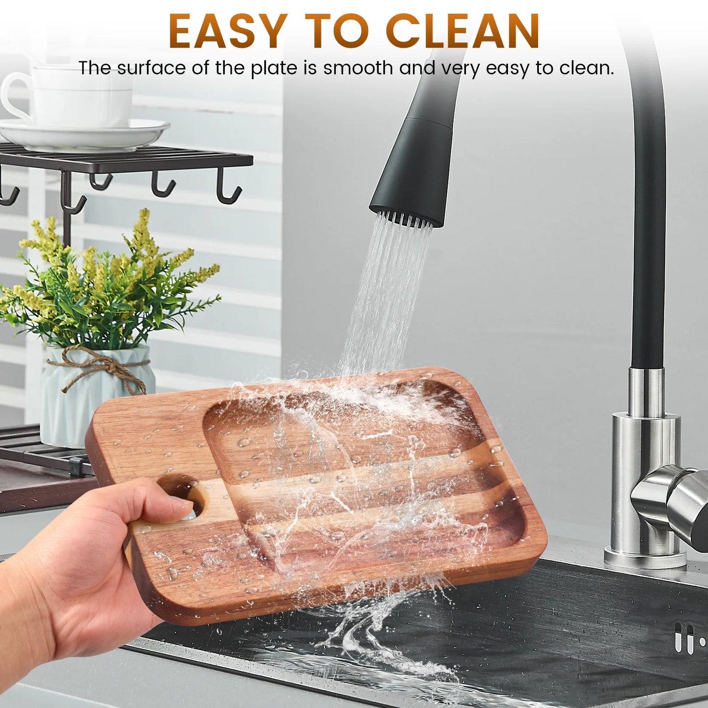 Wooden cutting board being rinsed under running water in a kitchen sink with text 'EASY TO CLEAN'.